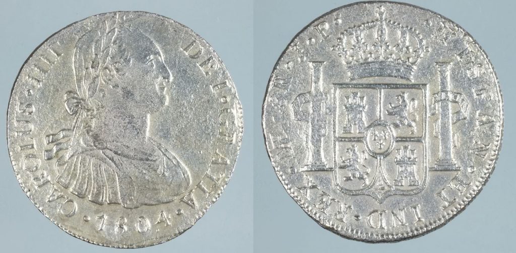 Monedas de 8 reales de plata de Carlos IV, Lima 1803. Procedente del pecio de la Mercedes Museo Arqueológico Nacional, Madrid ©Miguel Ángel Camón Cisneros