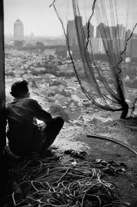 Sebastião Salgado. Most construction workers are migrants from rural areas, they live on the construction sites. Jakarta, Indonesia. 1996.