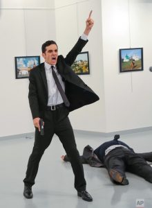 Burhan Ozbilici. An unnamed gunman gestures after shooting the Russian Ambassador to Turkey, Andrei Karlov, at a photo gallery in Ankara, Turkey, Monday, Dec. 19, 2016. AP Photo/Burhan Ozbilici.