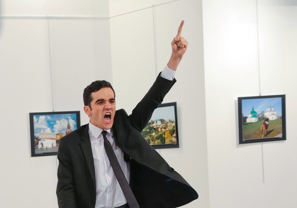 Burhan Ozbilici. An unnamed gunman gestures after shooting the Russian Ambassador to Turkey, Andrei Karlov, at a photo gallery in Ankara, Turkey, Monday, Dec. 19, 2016. AP Photo/Burhan Ozbilici.