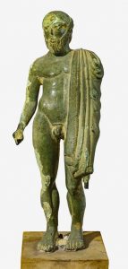 Estatuilla de Tinia (Zeus joven). Bronce. Finales del s V a.C. Florencia, Museo Arqueológico Nacional.